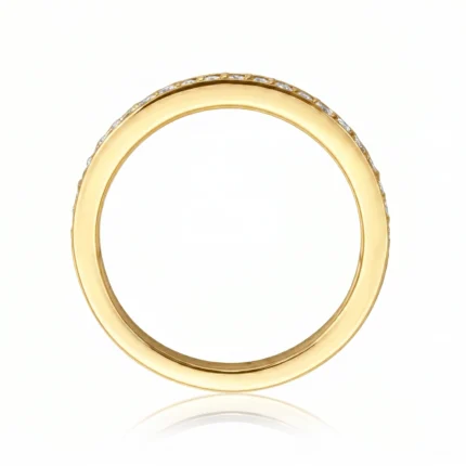 Gold ring with a row of small diamonds along the edge, shown against a white background (jewelry close-up).