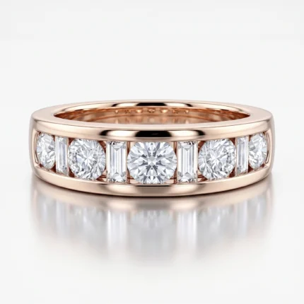 Rose gold ring with a row of alternating large and baguette diamonds set along the band, elegant and sparkly jewelry piece