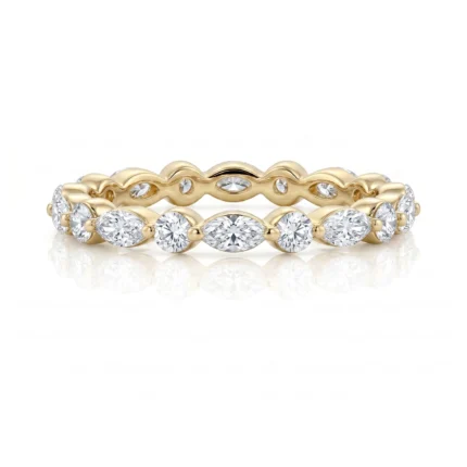 Yellow-gold ring with a wavy band and alternating round and marquise-cut diamonds