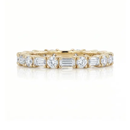 Gold ring featuring alternating round and baguette-cut diamonds along the band.