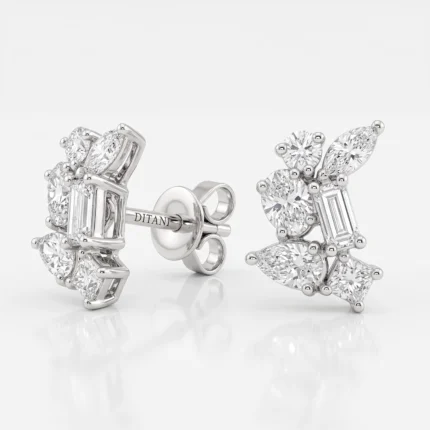 Diamond cluster earrings in white metal with round, marquise, and baguette-cut stones, displayed against a pale background.