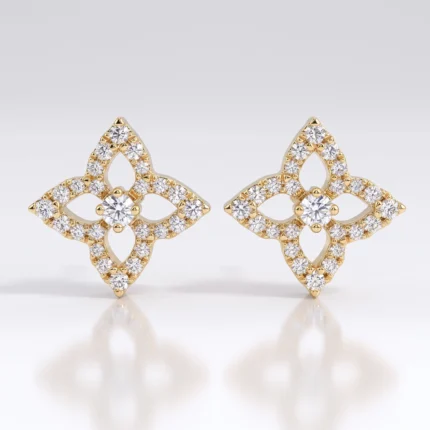 Pair of gold-tone diamond-studded earrings in a four-leaf clover motif, with a central diamond and surrounding pavé stones.