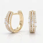 Gold rings encrusted with diamonds, featuring rows of round stones and rectangular baguette cuts for a stacked look.