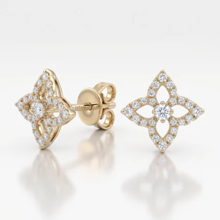 Gold stud earrings with diamond pavé in a diamond-shaped four-petal (quatrefoil) floral design and butterfly backs.