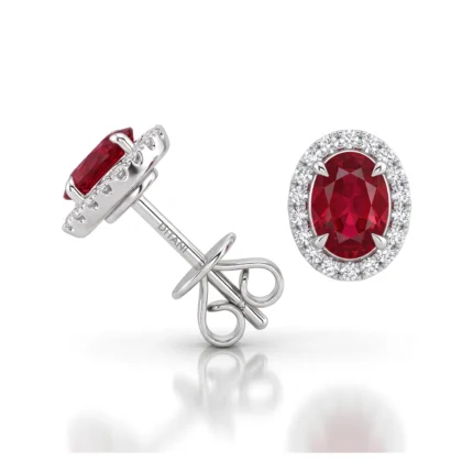Oval red gemstone stud earrings with diamond halo in silver setting and screw back posts