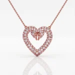 Rose gold heart-shaped pendant encrusted with diamonds on a chain, featuring two diamond swans forming the top.