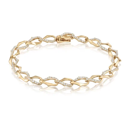 Gold bracelet with diamond-studded links on a white background, showing a polished clasp edge of the chain