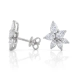 Diamond-studded silver butterfly/flower earring with five petal-shaped diamond petals arranged around a center, shown from side and front with butterfly backings
