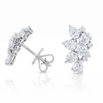 White gold diamond leaf earrings with pear-cut stones arranged in a clustered pattern.