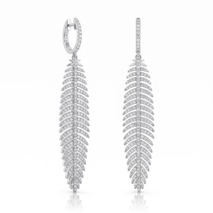Diamond-studded drop earrings in a fern leaf design, with a vertical row of pavé-set stones on each leaf motif.