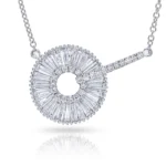 Diamond halo pendant: a circular ring of baguette-cut diamonds around a hollow center, with a diamond-studded bar extending to the right on a silver chain.