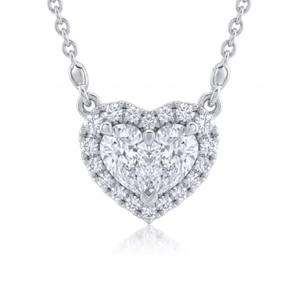 Heart-shaped pendant necklace with a large central diamond surrounded by smaller pavé diamonds on a silver chain