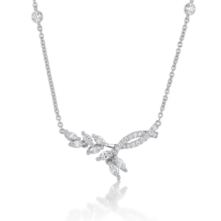 Silver necklace with a diamond-encrusted leaf-and-flower pendant on a delicate chain.
