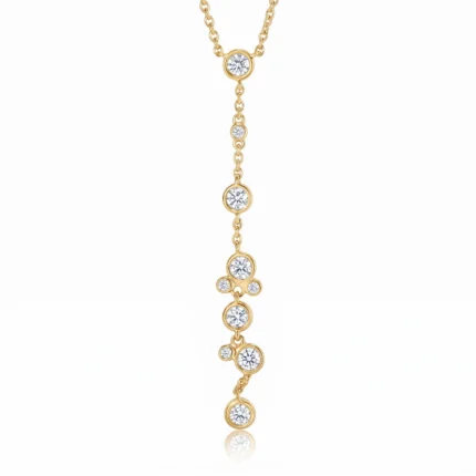 Gold necklace with a delicate vertical drop featuring several diamond-studded circles along a fine chain