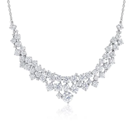 Diamond necklace with two curved rows of round-cut stones set in silver metal, sparkling along the chain.