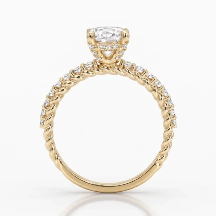 Gold twisted-rope engagement ring with pavé diamonds along the band and a large cushion-cut center diamond.