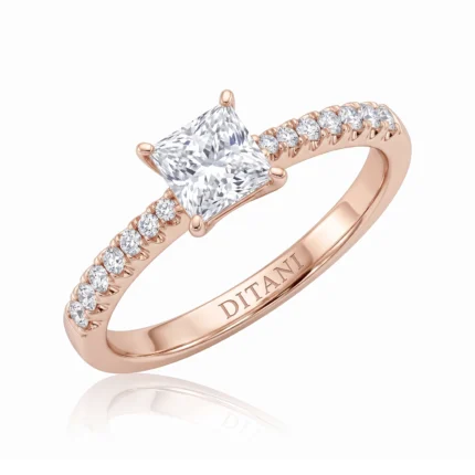 Rose gold engagement ring with a square princess-cut center diamond and pavé diamonds along the band.