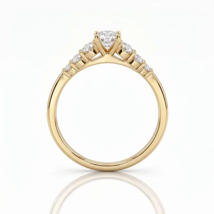 Gold engagement ring with a large central diamond and smaller diamonds along the band set in yellow gold