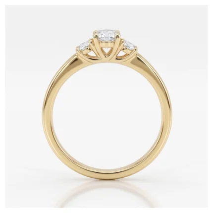 Gold ring with a central diamond and two side stones set in an elegant prong setting, on a smooth band.