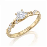 Gold ring with a large central diamond and smaller diamonds along a twisted band