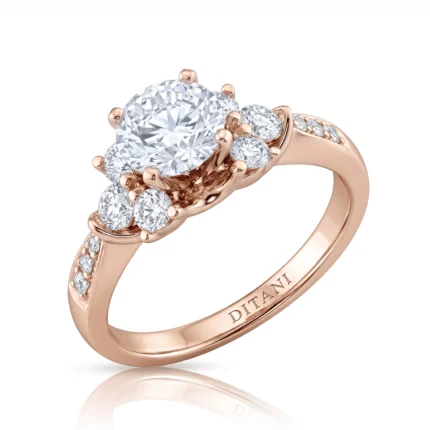 Rose gold ring with a large central diamond and surrounding pavé diamonds, elegant prong setting and engraved inner band reading DITANI.