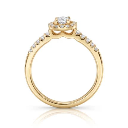 Gold ring with a halo of pavé diamonds and a central cushion-cut diamond on a raised setting, filigree undergallery visible, elegant jewelry piece.