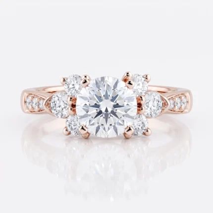Rose gold engagement ring with a large central diamond surrounded by six smaller diamonds; diamonds also set along the band.
