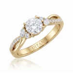 Yellow gold ring with a large central round diamond, smaller side diamonds, and 'DITANI' engraved on the inner band
