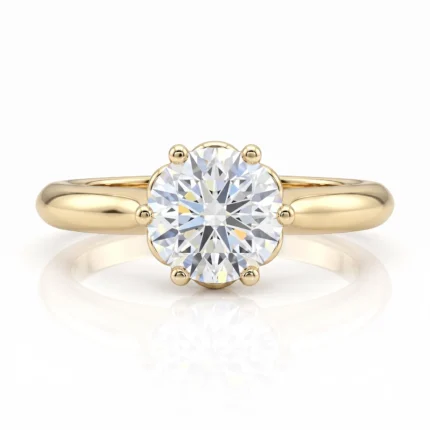 Gold engagement ring with a large round-cut diamond held by six prongs in a smooth yellow-gold band.