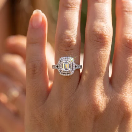 Close-up of a diamond engagement ring on a finger, sunlight sparkling off the stones.
