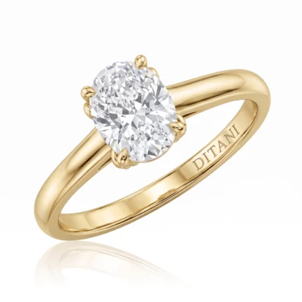 Gold ring featuring a large oval-cut diamond set in a four-prong setting, with 'DITANI' engraved on the band.