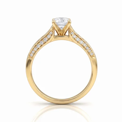Yellow gold engagement ring with a round center diamond and pavé diamonds along the band shoulders, held by prongs.