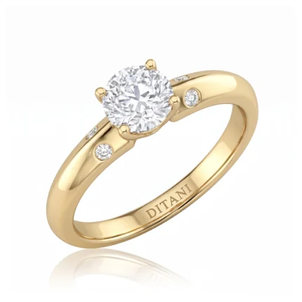 Gold engagement ring with a large round-cut diamond in a prong setting and small diamonds along the band, inscribed with 'DITANI' on the inner side.