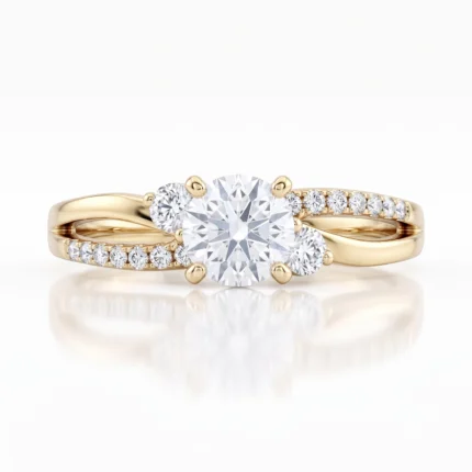 Gold ring featuring a prominent central round diamond with two smaller side diamonds and a pavé diamond band on both sides, set in yellow gold.