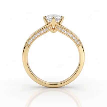 Gold engagement ring with a central diamond in a prong setting and pavé diamonds along the shoulders of the band.