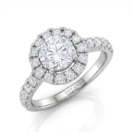 Diamond halo engagement ring with a large central stone surrounded by a double halo of smaller diamonds and a pavé Diamond band in white metal.