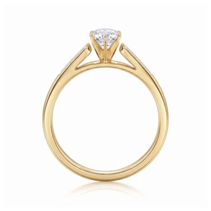 Gold solitaire engagement ring with a diamond center stone and pavé-accented shoulders on a white background.