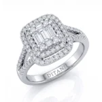 Diamond ring with four baguette-cut center stones surrounded by a double halo of round diamonds on a polished band.