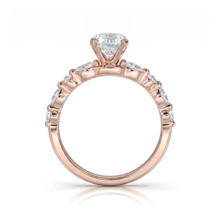 Rose gold engagement ring with a large central diamond and smaller diamonds set along the band