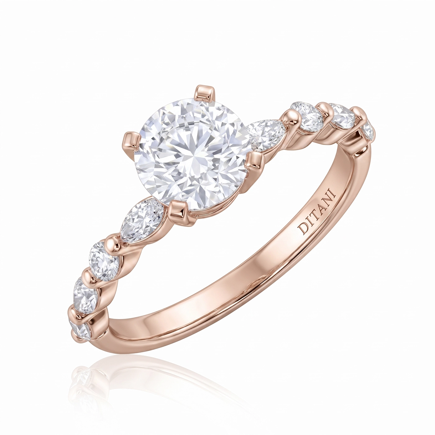 Годежен пръстен с диаманти DITANI - DITANI Rose gold ring with a large round center diamond and smaller diamonds along a twisted band.
