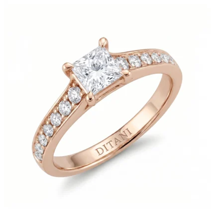 Rose gold engagement ring with a princess-cut center diamond and pavé diamonds along the band.