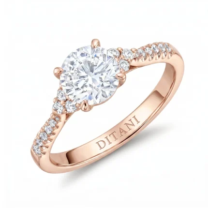 Rose gold engagement ring with a large round center diamond and smaller diamonds along the band.