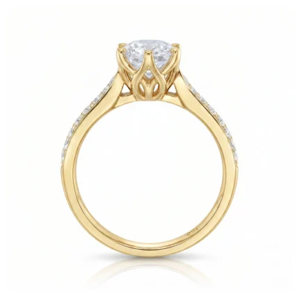Gold engagement ring with a large round diamond in a six-prong setting and small diamonds along the band, shown from the side to highlight the setting's openwork.