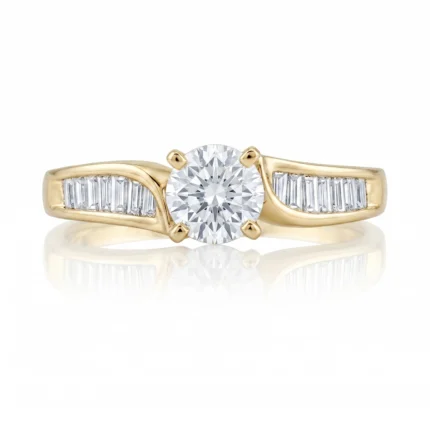 Gold ring with a round center diamond and baguette side stones set in yellow gold.