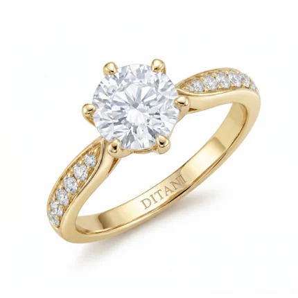 Gold ring with a large round-cut central diamond and pavé diamonds along the shoulders, set in a yellow-gold band.