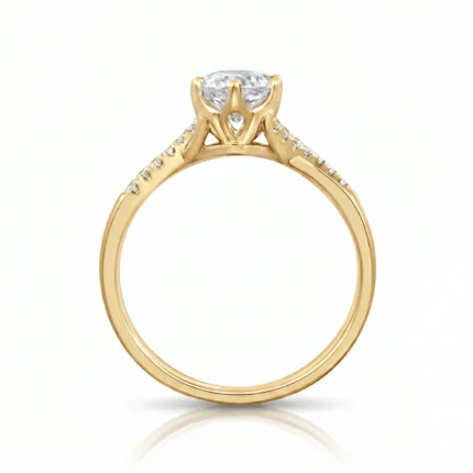 Gold engagement ring with a round diamond solitaire and diamond-studded band.]?