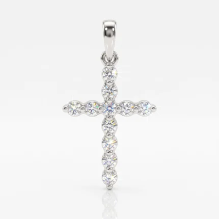 Cross-shaped pendant in polished silver with evenly spaced diamonds, photographed against a white background to highlight sparkle and shine.