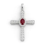 Cross-shaped pendant in white metal with a central red gemstone surrounded by a halo of small diamonds