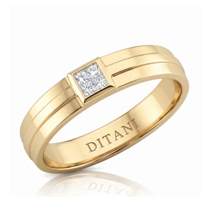 Gold band with a square-cut diamond set in a bezel on the top, showing a polished finish and inner engraving.