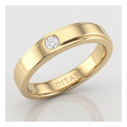 Gold band ring with a single round diamond set flush into the bezel; inner engraving reads DITANI.